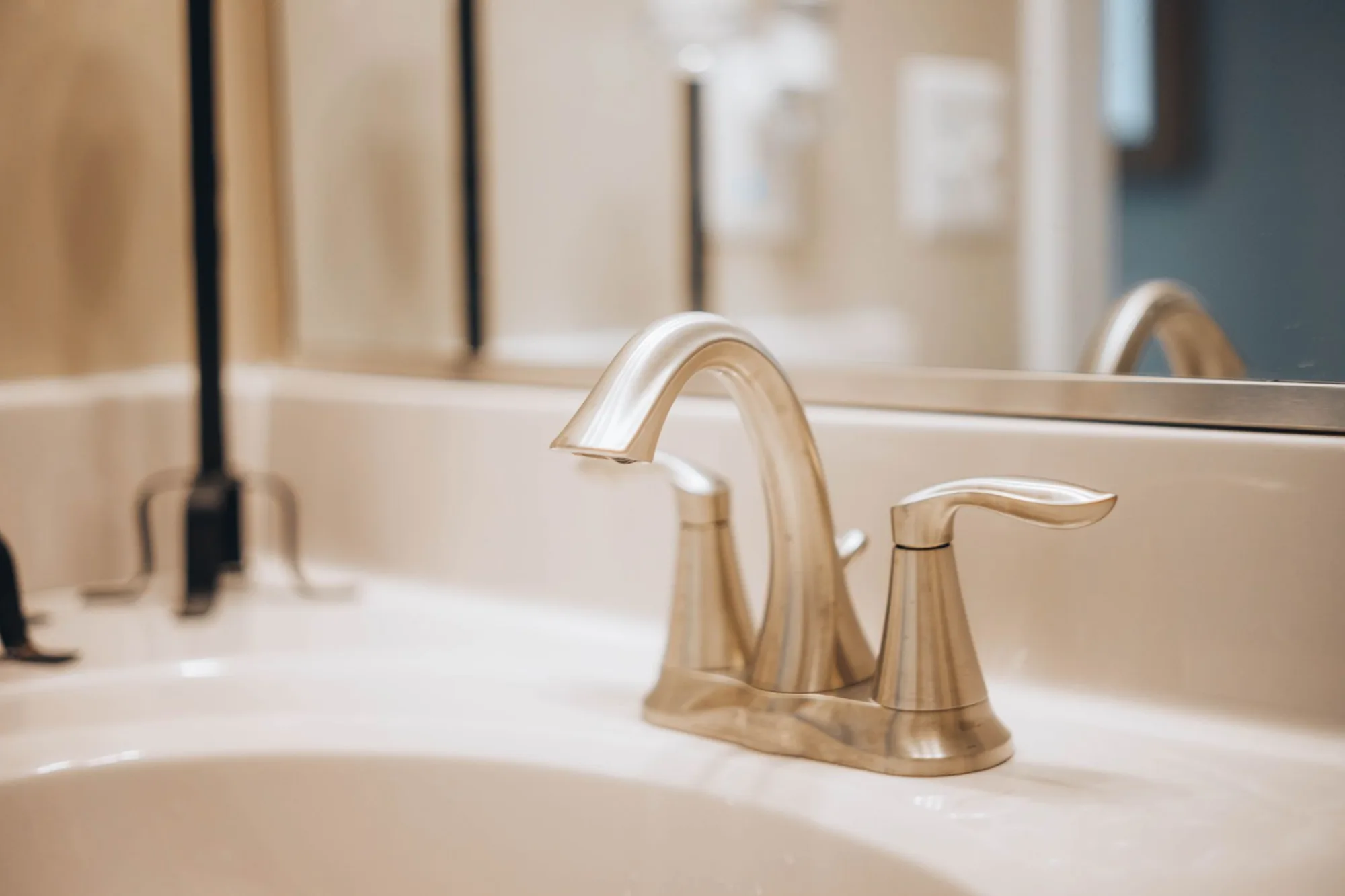 Polished bathroom faucet installed on a clean vanity by A.A. Buckley Plumbing in Atlanta