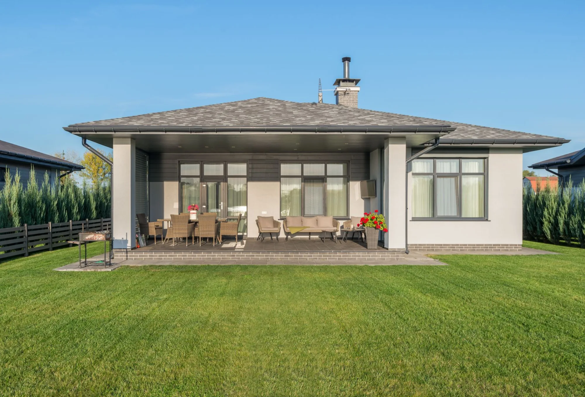 A tidy modern home with a healthy, freshly cut green lawn
