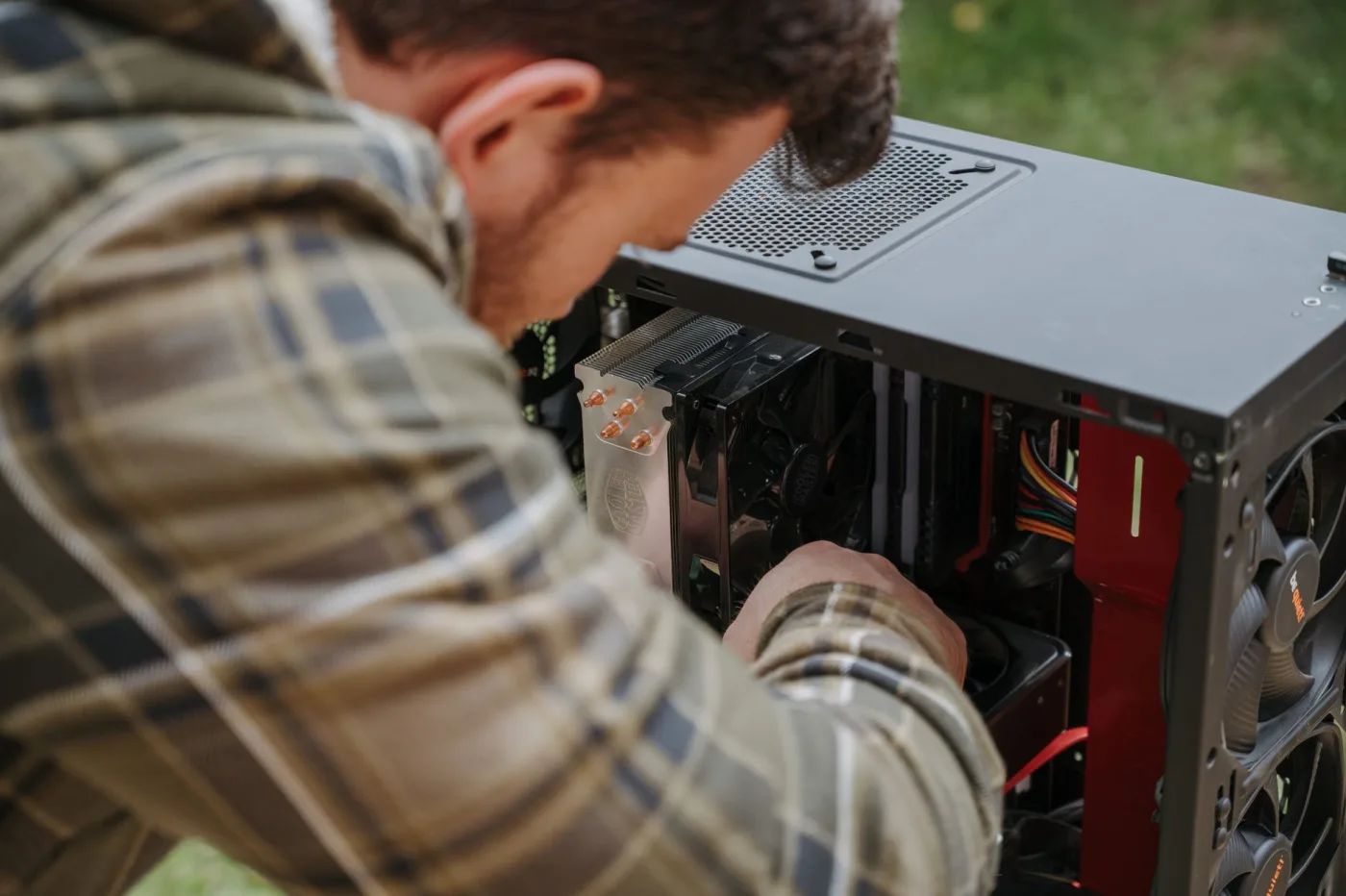 Electrician working inside an open electrical box