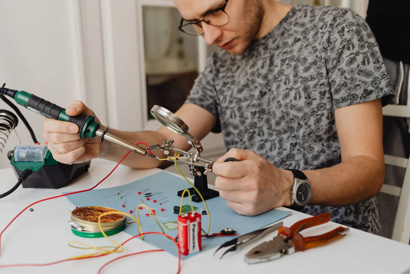 Raiden electrician working on fine wiring at a bench