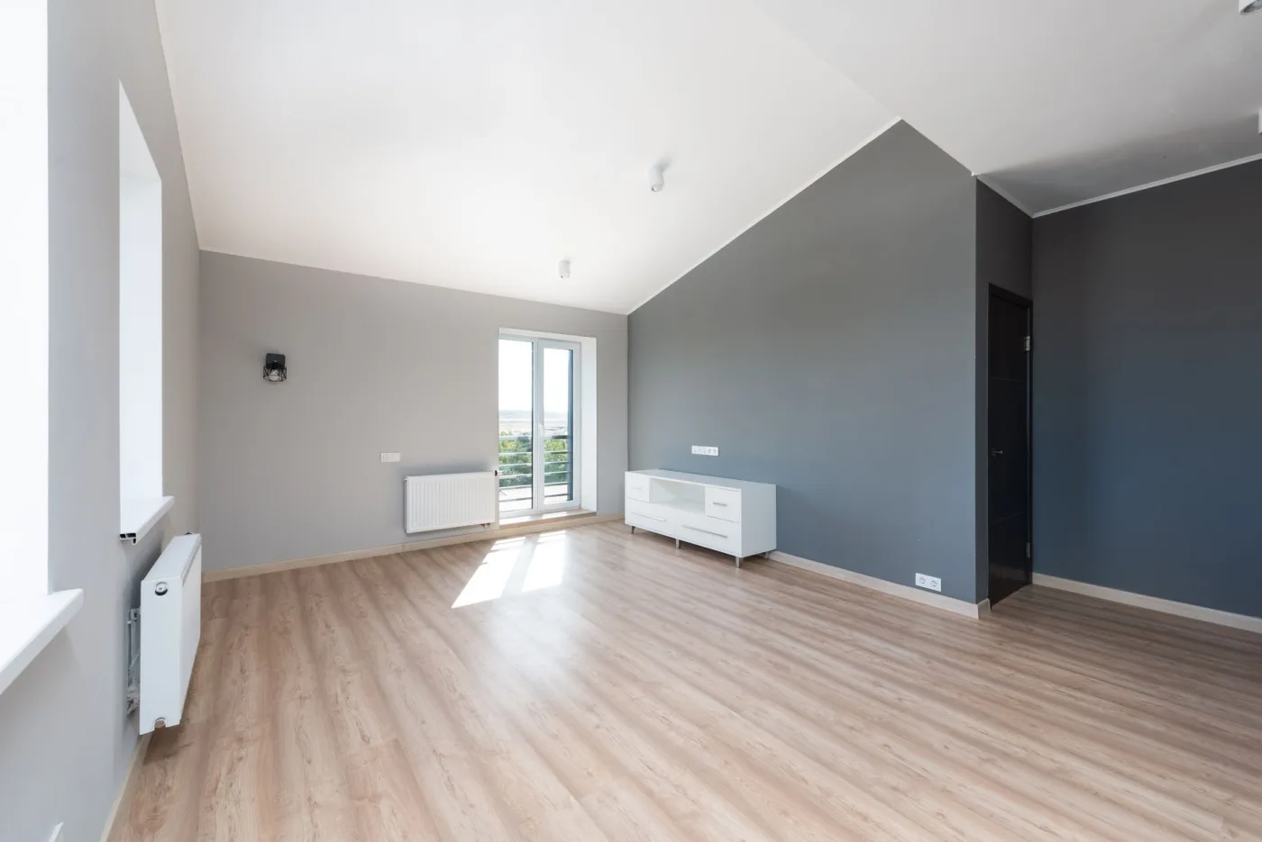 Renovated living space with new flooring and finishes