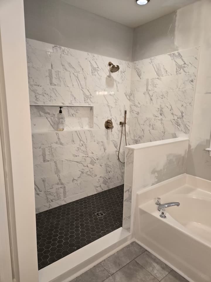 Tile finished and the curb set, photographed before the glass went in.