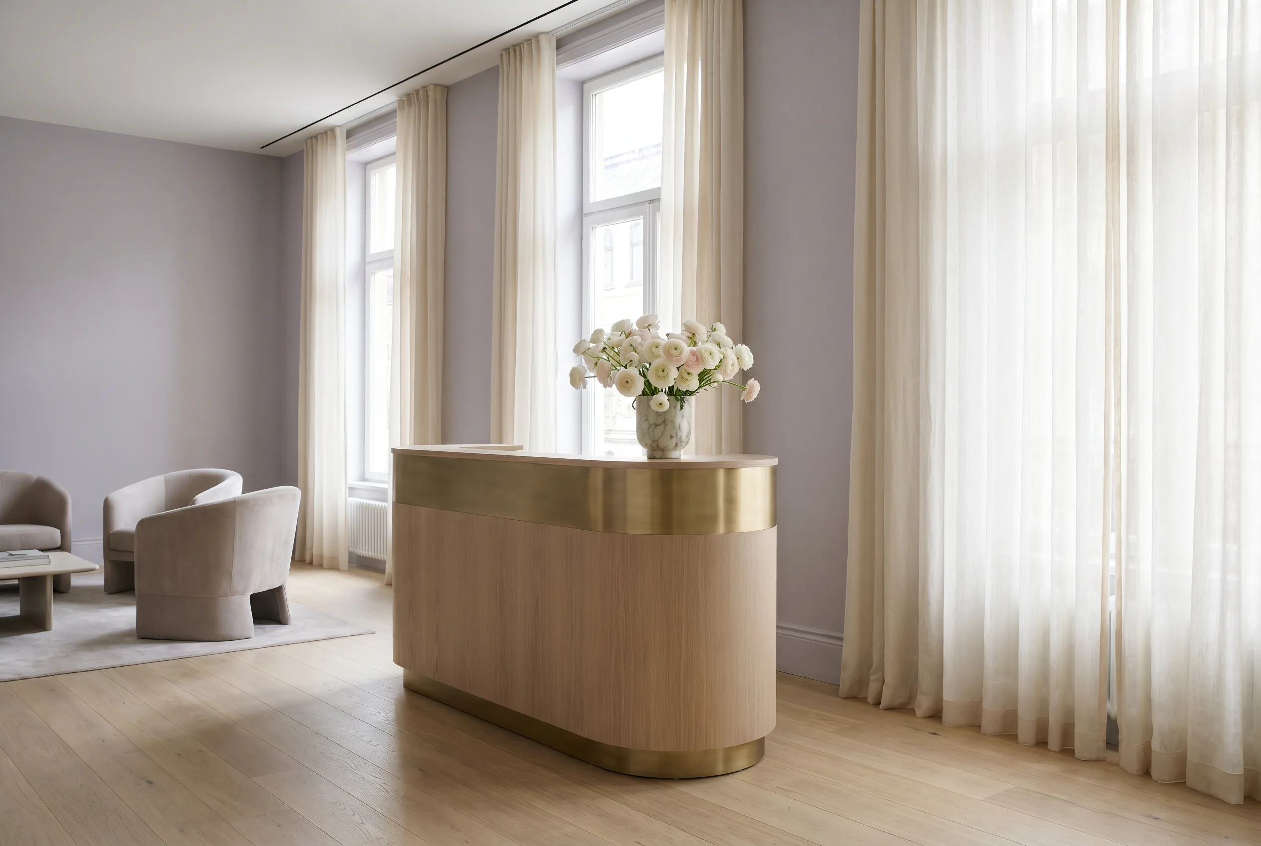 The serene lavender-and-ivory interior of Après Plastic Surgery